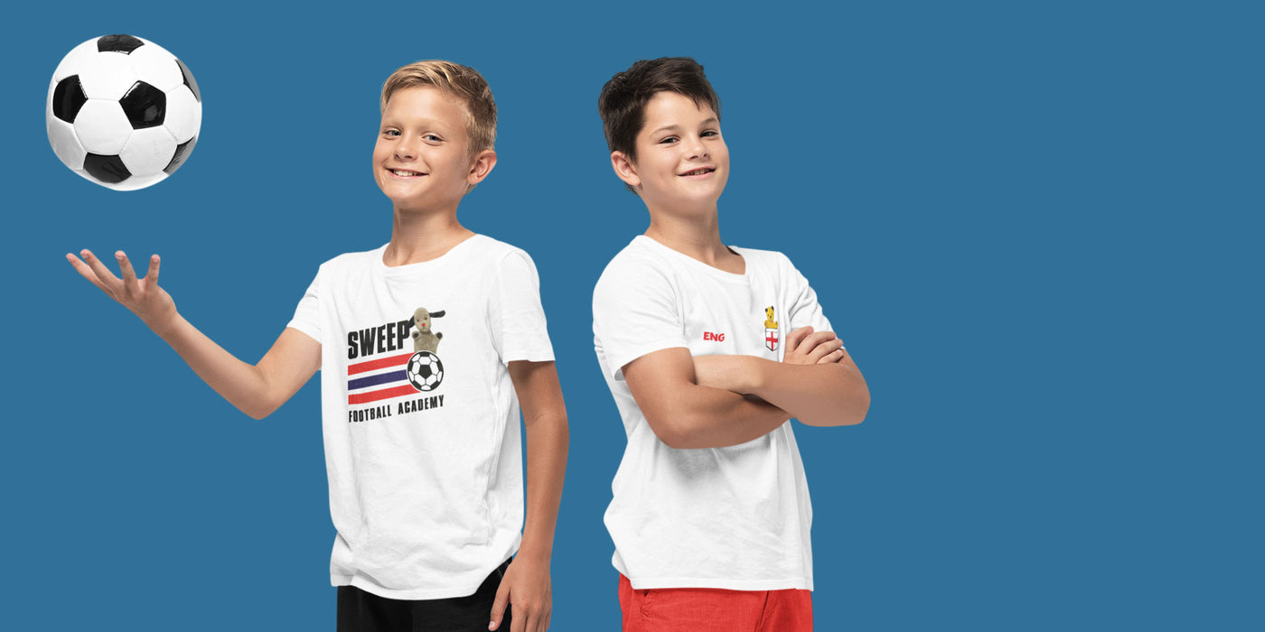 Two young boys holding a football and wearing Sooty and Sweep England Supporters T-Shirts